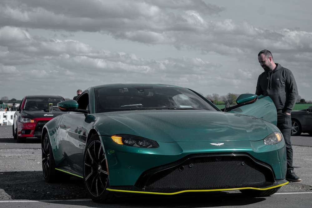 Performance car parked under dramatic lighting