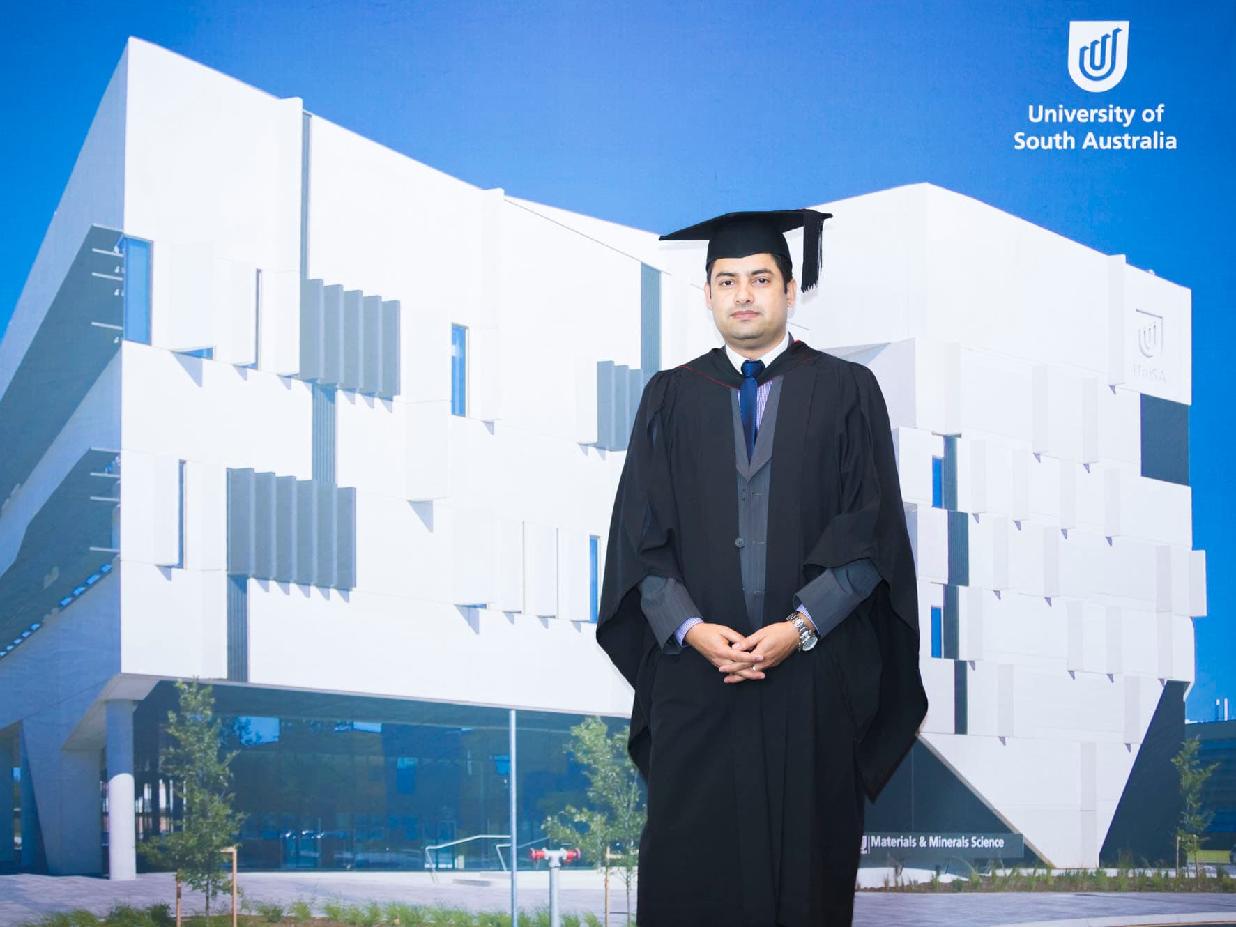 Graduates celebrating and throwing caps into the air