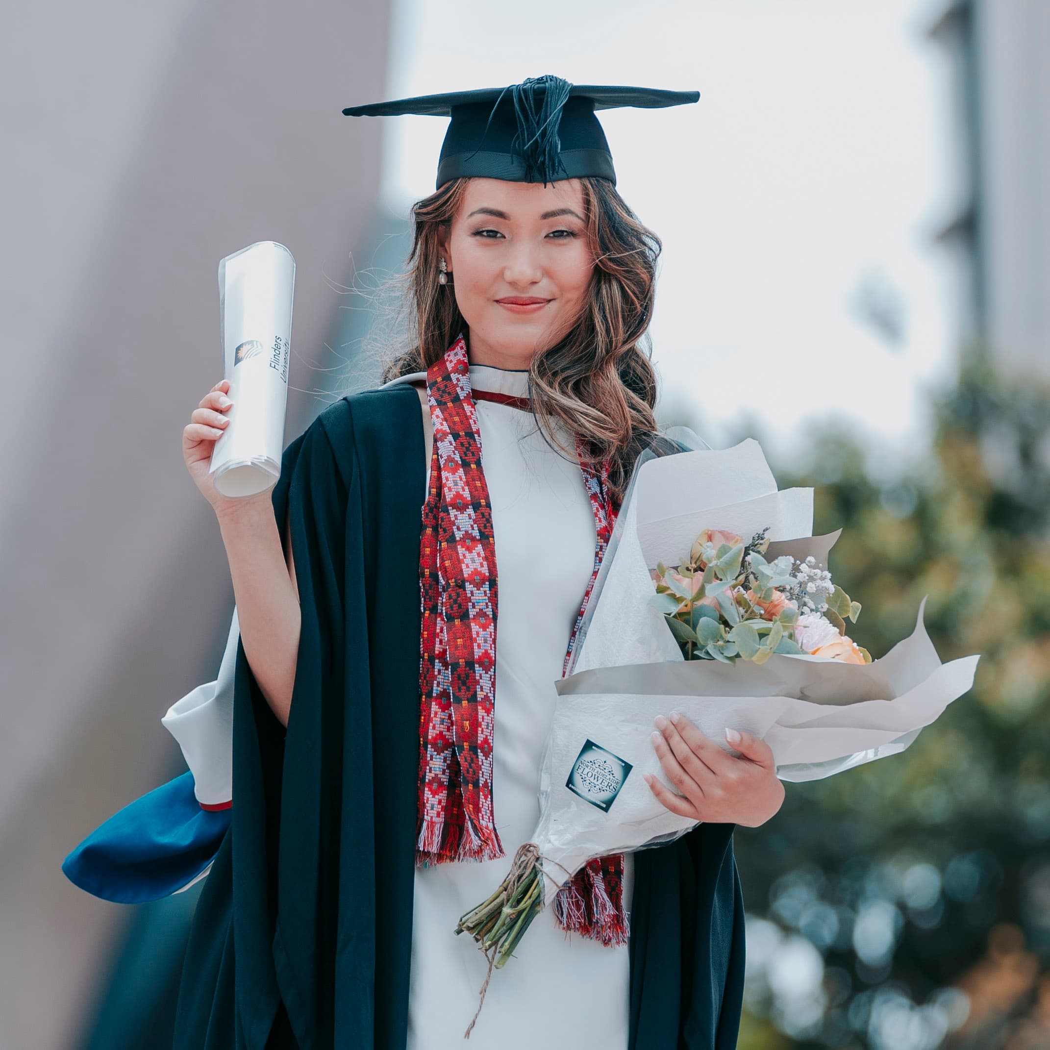 Graduation ceremony scene with graduates seated and waiting