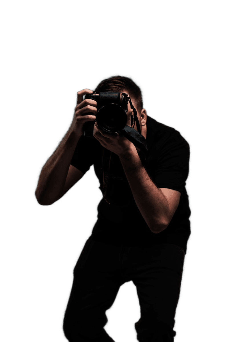 Photographer adjusting lens