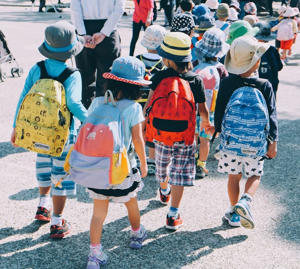 Students gathered outdoors at school during a group event