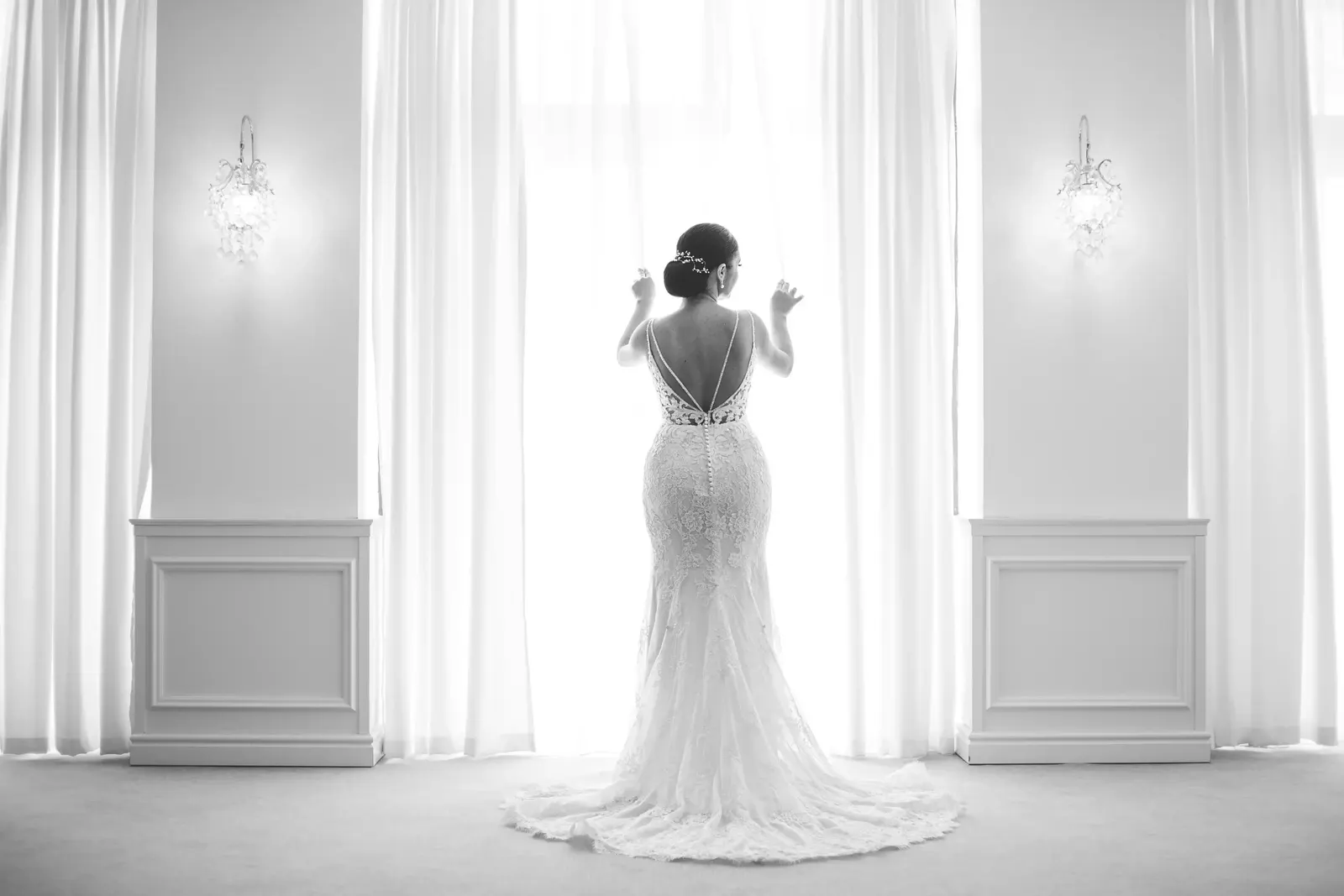 Bride at a window in a lace gown, Adelaide wedding, photographed by Sujan Studio